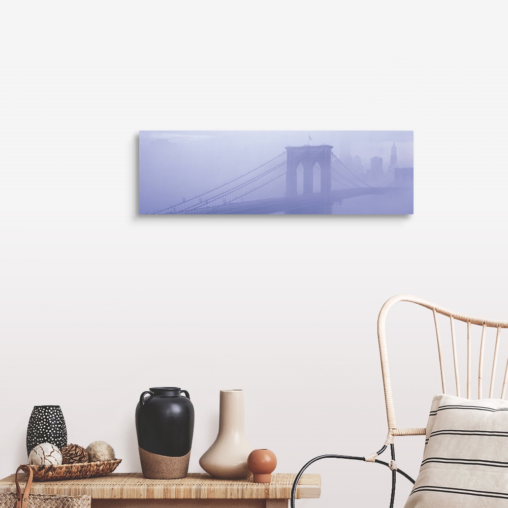 A farmhouse room featuring Panoramic photograph on a giant wall hanging of fog surrounding New York's famous Brooklyn Bridge...
