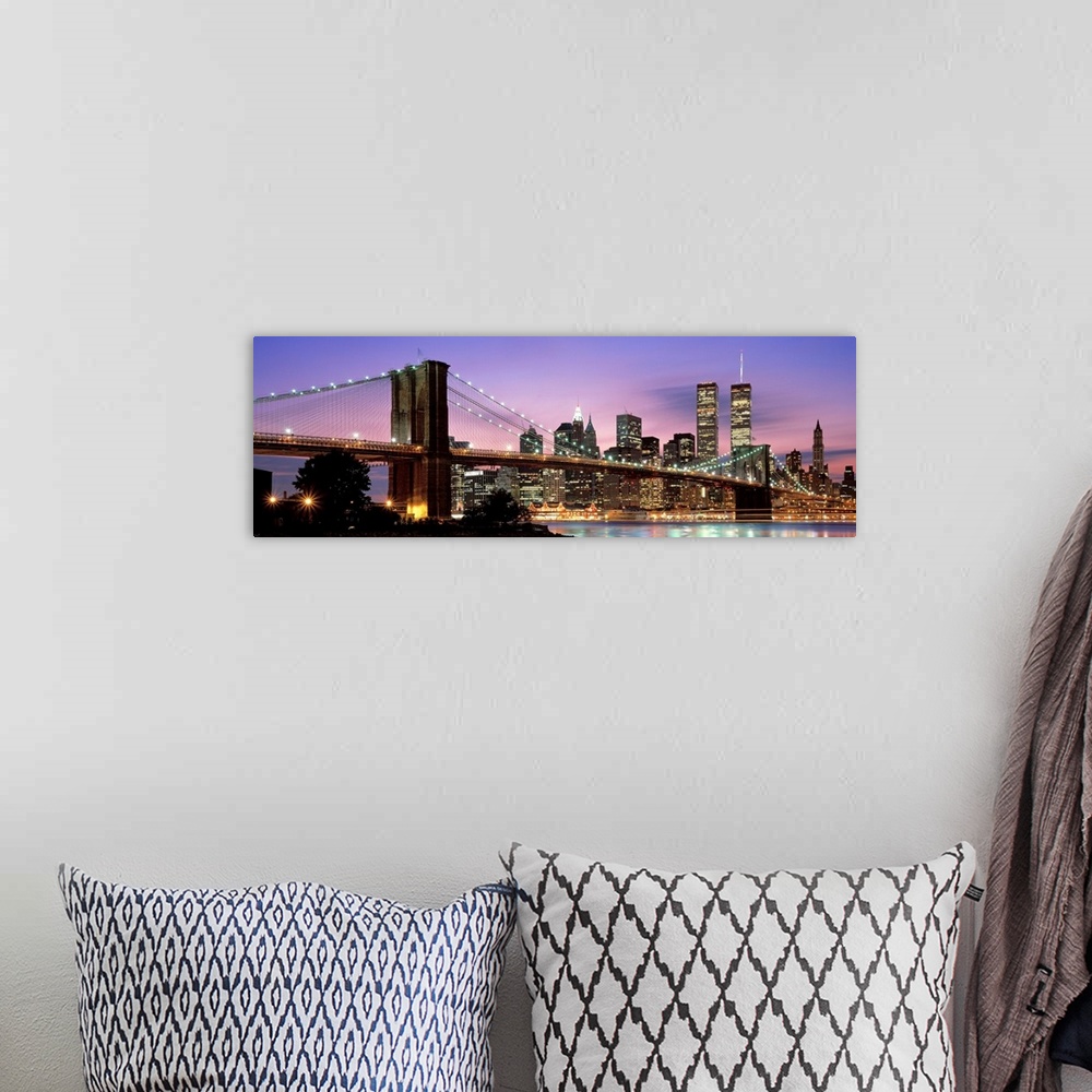 A bohemian room featuring This large wall art has a dominating sky at twilight giving a panoramic view of lower Manhattan a...