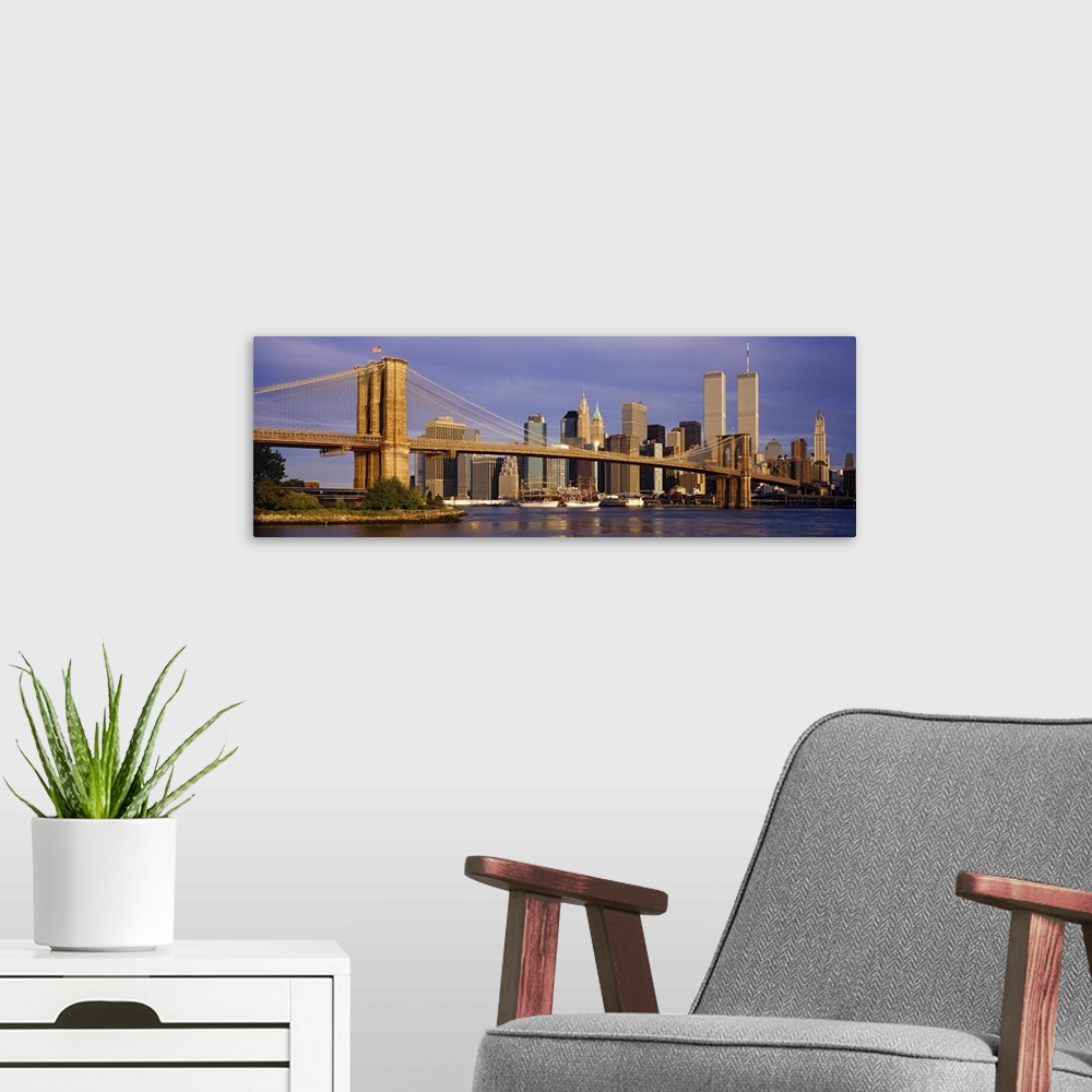 A modern room featuring Panoramic, giant photograph of the Brooklyn Bridge in the sunlight, the New York City skyline in ...
