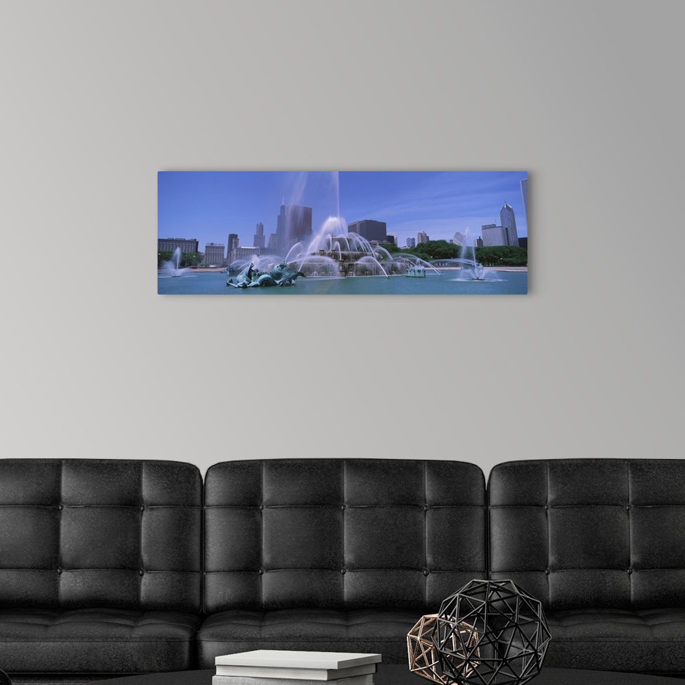A modern room featuring Landscape, close up photograph of Buckingham Fountain during the day, the skyscrapers of Chicago ...