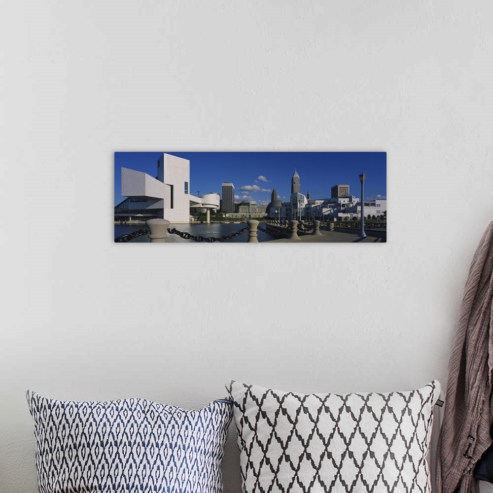A bohemian room featuring Panoramic picture taken of several buildings lining a body of water in Cleveland Ohio.