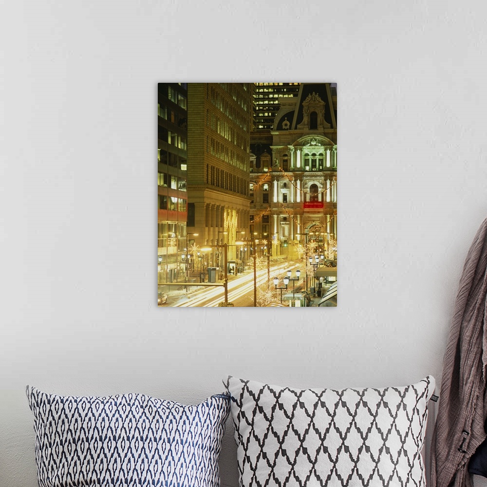 A bohemian room featuring Vertical photograph on a big canvas of a brightly lit street in Philadelphia and city hall lit at...