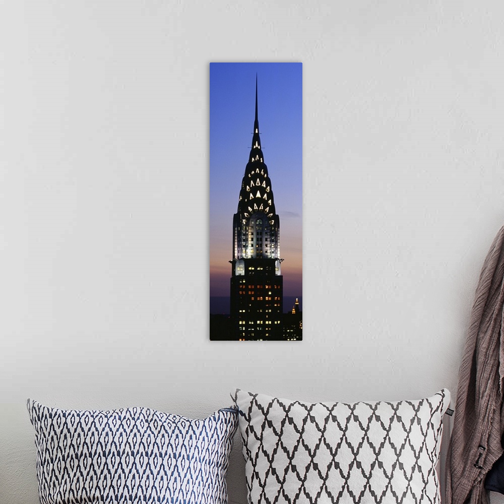 A bohemian room featuring Vertical, oversized photograph of the top of the Chrysler Building in New York City, lit up again...