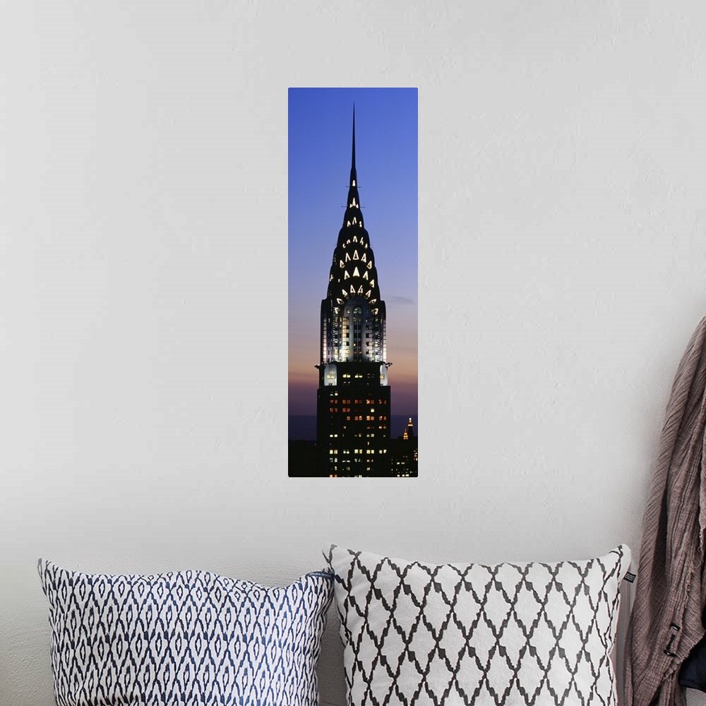 A bohemian room featuring Vertical, oversized photograph of the top of the Chrysler Building in New York City, lit up again...