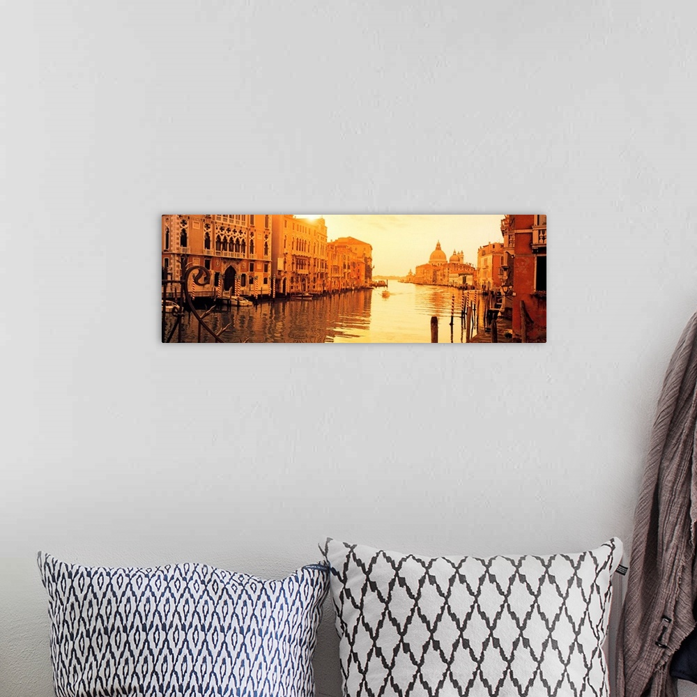 A bohemian room featuring This panoramic photograph captures a still moment in the canals at sunset and this historic city ...