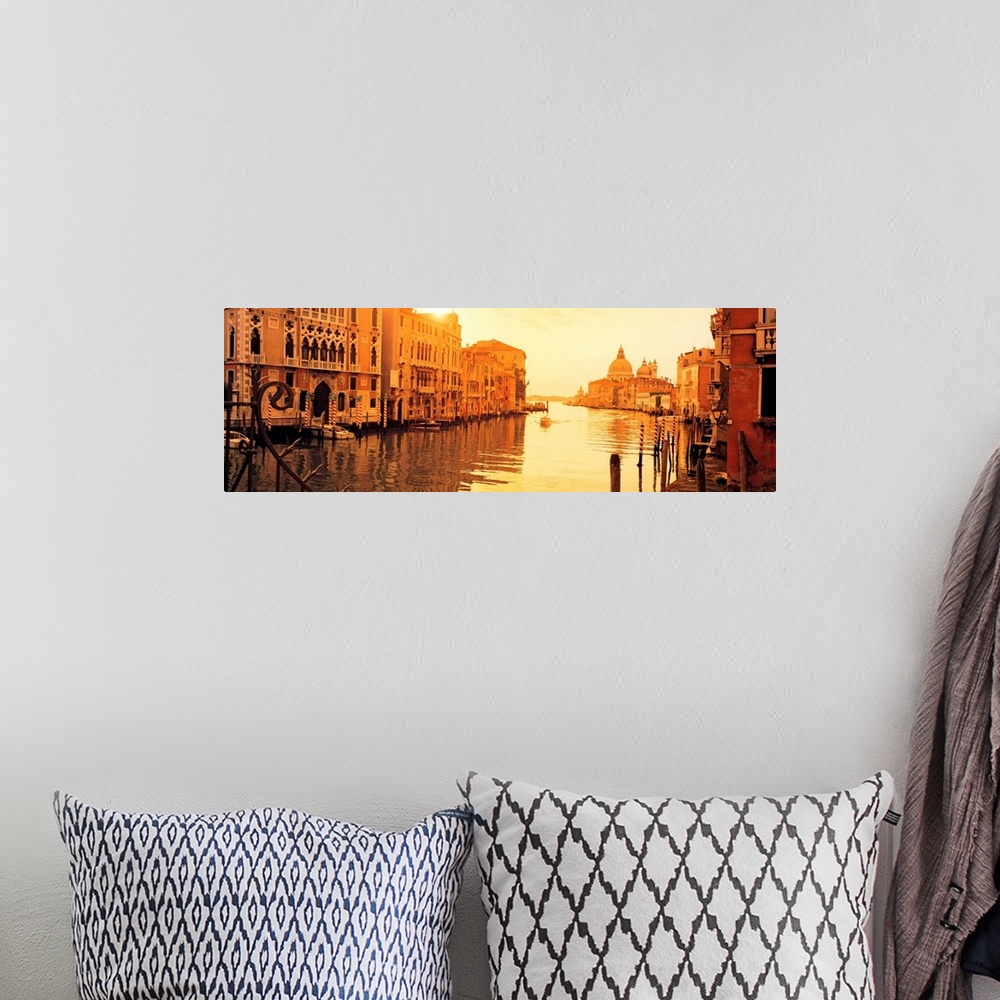 A bohemian room featuring This panoramic photograph captures a still moment in the canals at sunset and this historic city ...