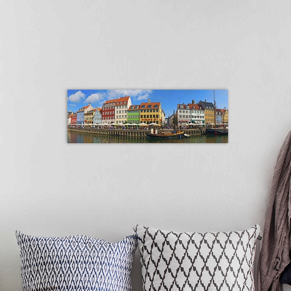 A bohemian room featuring Buildings along a canal with boats, Nyhavn, Copenhagen, Denmark