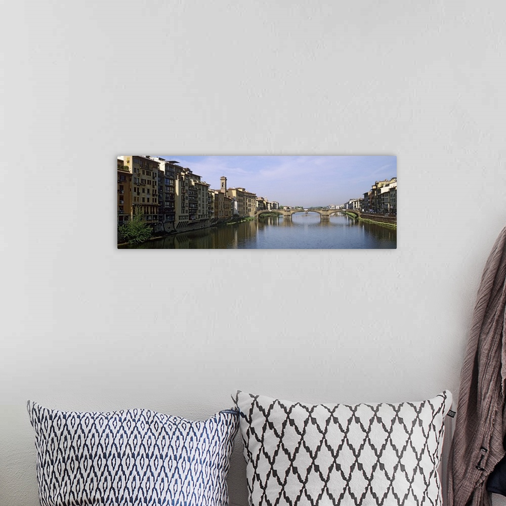 A bohemian room featuring Buildings along a river, Arno river, Florence, Tuscany, Italy
