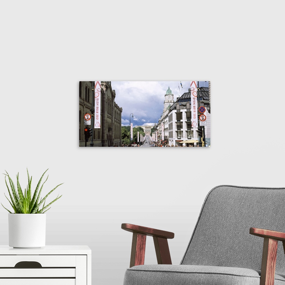 A modern room featuring Buildings along a street with Royal Palace in the background Karl Johan Street Oslo Norway