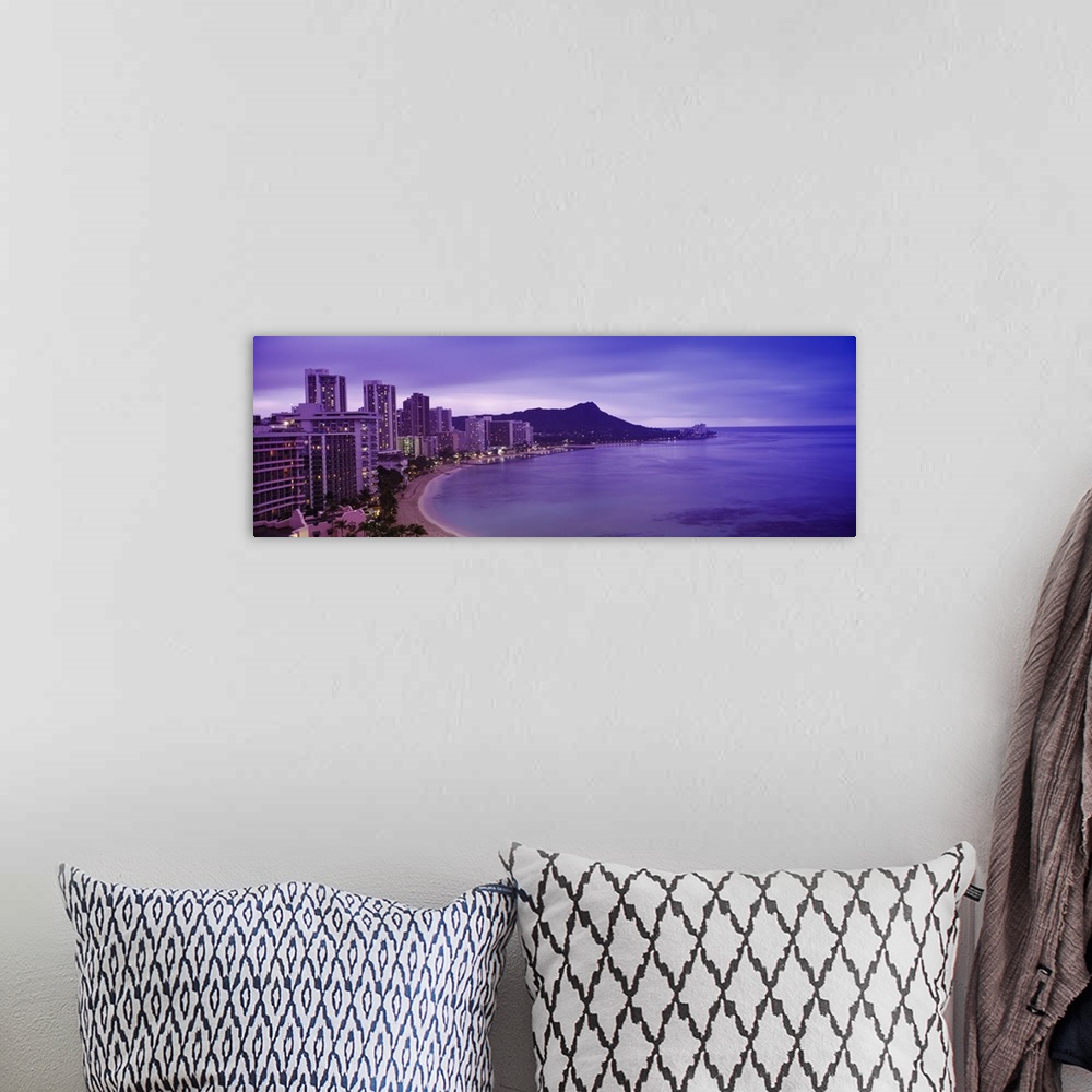 A bohemian room featuring Buildings at the coastline with a volcanic mountain in the background, Diamond Head, Waikiki, Oah...
