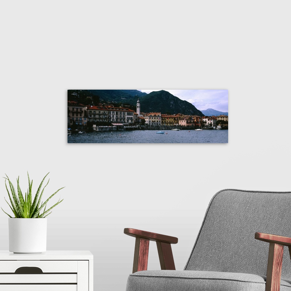 A modern room featuring Buildings at the lakeside viewed from a ferry, Lake Como, Menaggio, Como, Lombardy, Italy