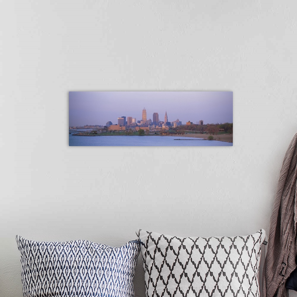 A bohemian room featuring The skyline in Cleveland is shot with a wide angle lens from across a body of water.
