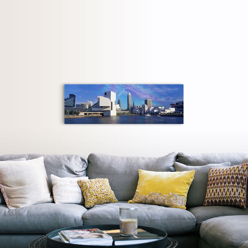A farmhouse room featuring A panoramic photograph of the city skyline built up along a river.