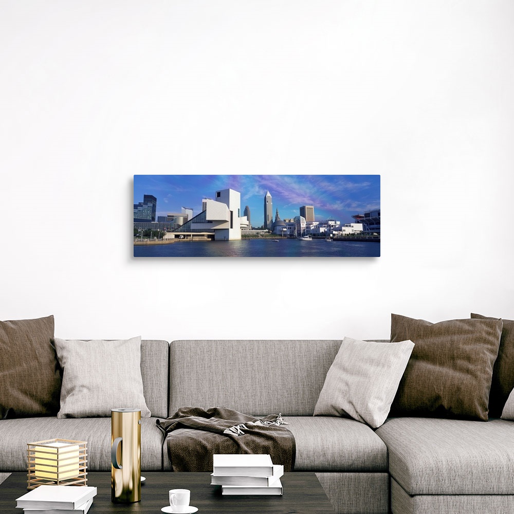 A traditional room featuring A panoramic photograph of the city skyline built up along a river.