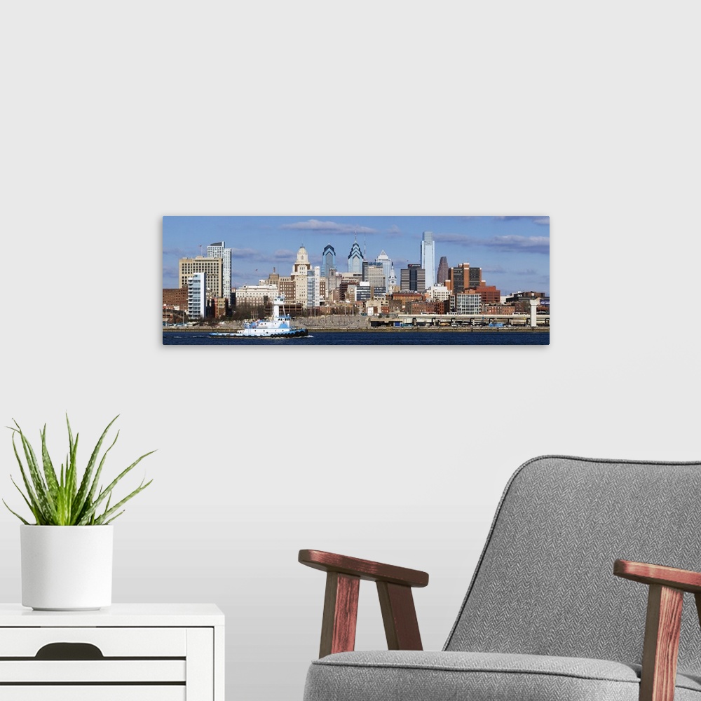 A modern room featuring Giant panoramic photo of the city of Philadelphia, Pennsylvania (PA). A large barge chugs along t...