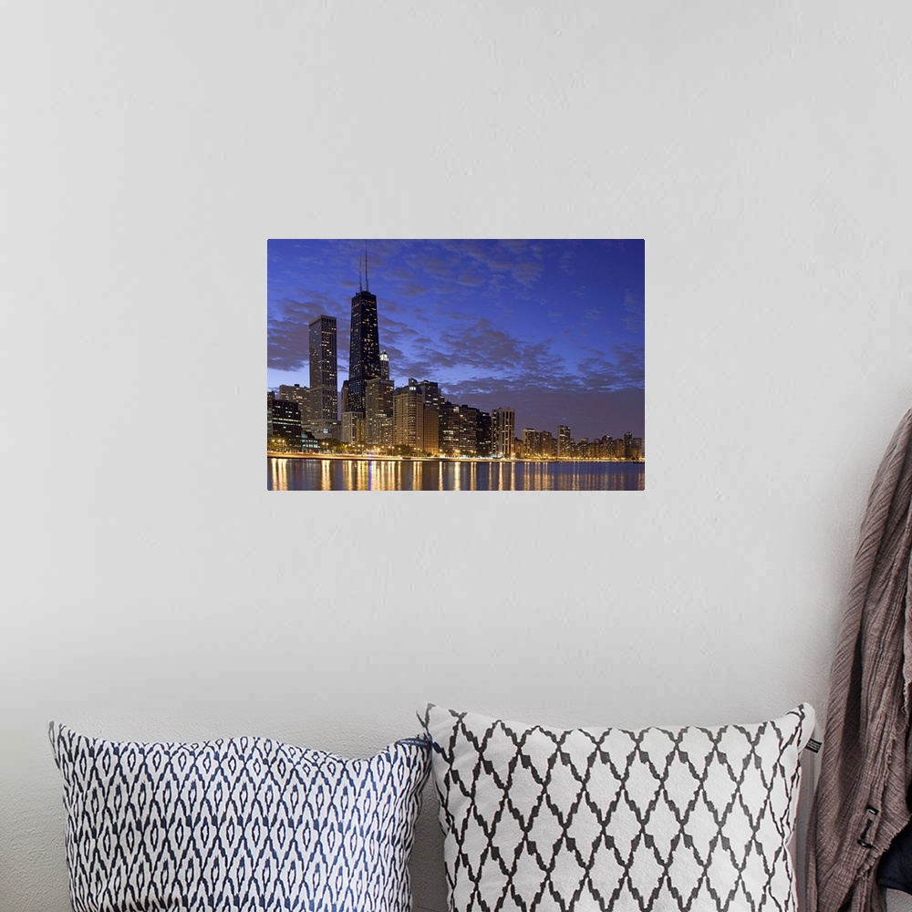 A bohemian room featuring Large photo on canvas of the Chicago cityscape lit up at night reflecting into the nearby waterfr...