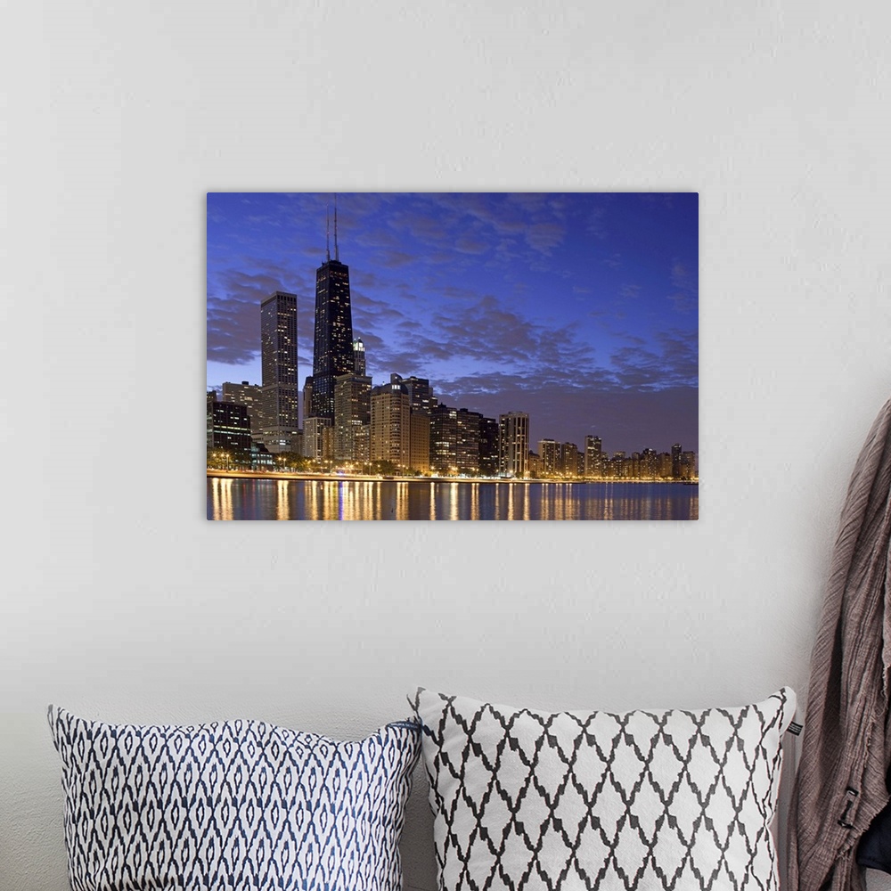 A bohemian room featuring Large photo on canvas of the Chicago cityscape lit up at night reflecting into the nearby waterfr...