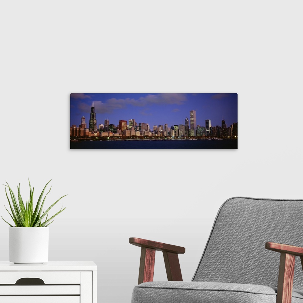 A modern room featuring Panoramic photograph displays the busy skyline of a famous city within the Midwestern United Stat...