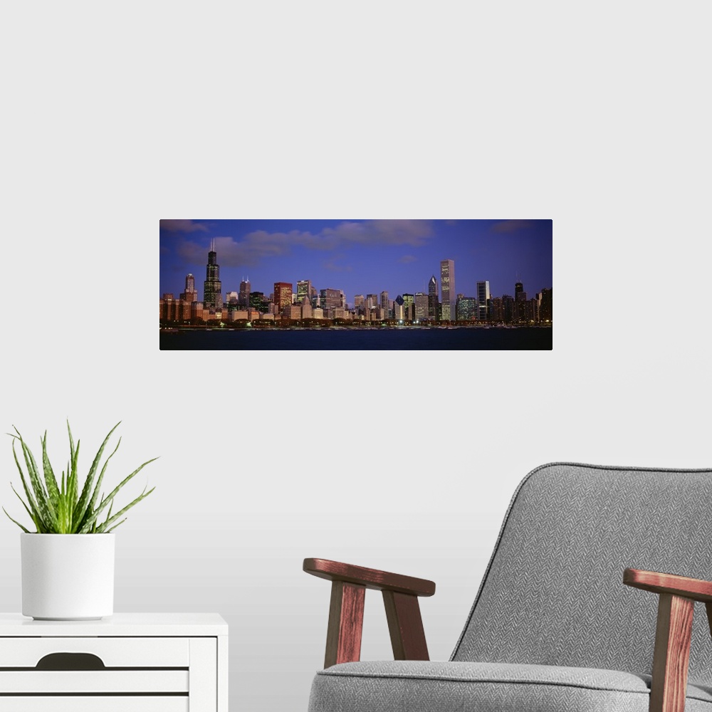 A modern room featuring Panoramic photograph displays the busy skyline of a famous city within the Midwestern United Stat...