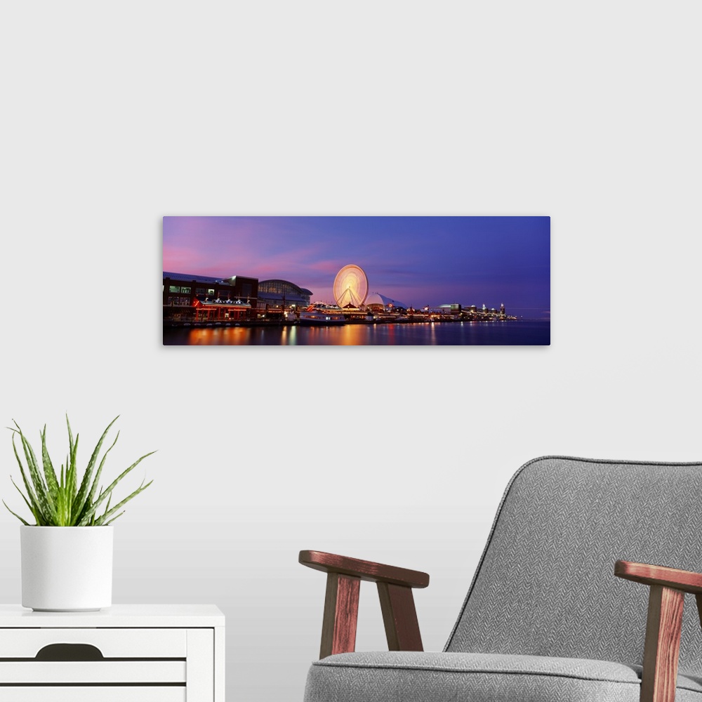 A modern room featuring Panoramic photo on canvas of buildings lit up along the waterfront in Chicago with a ferris wheel.