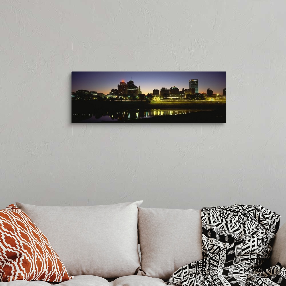 A bohemian room featuring Panoramic skyline of Memphis, Tennessee as the sun begins to rise over the Mississippi river.