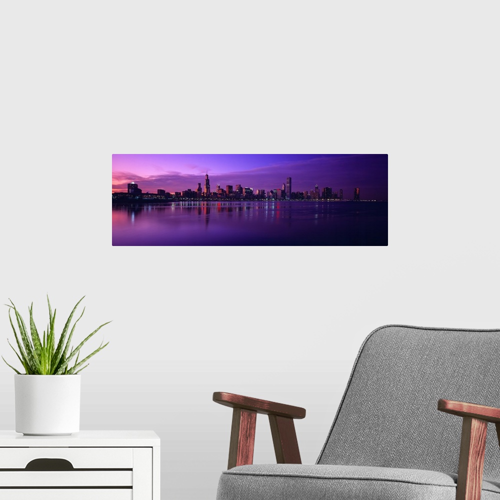 A modern room featuring Giant, landscape photograph of Lake Michigan beneath a vibrant sunset and the Chicago skyline on ...