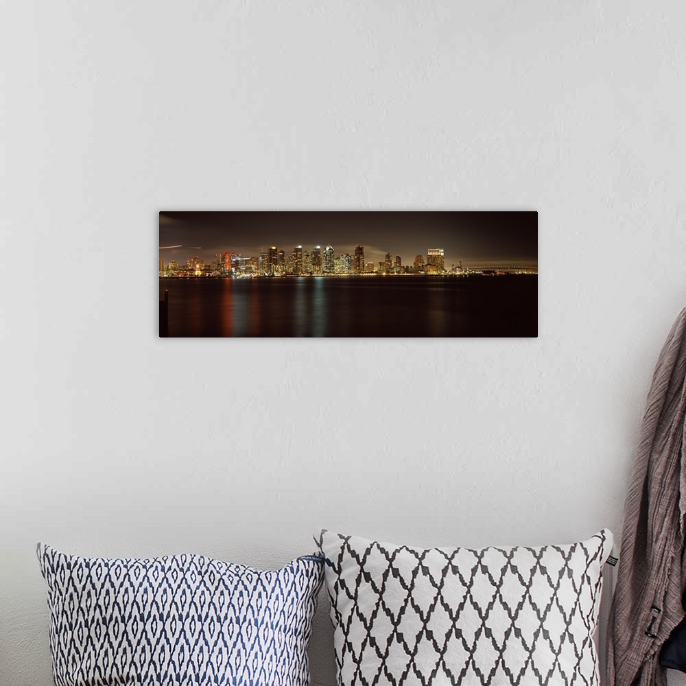 A bohemian room featuring Panoramic photograph of the San Diego city skyline along the edge of the bay in the evening, the ...