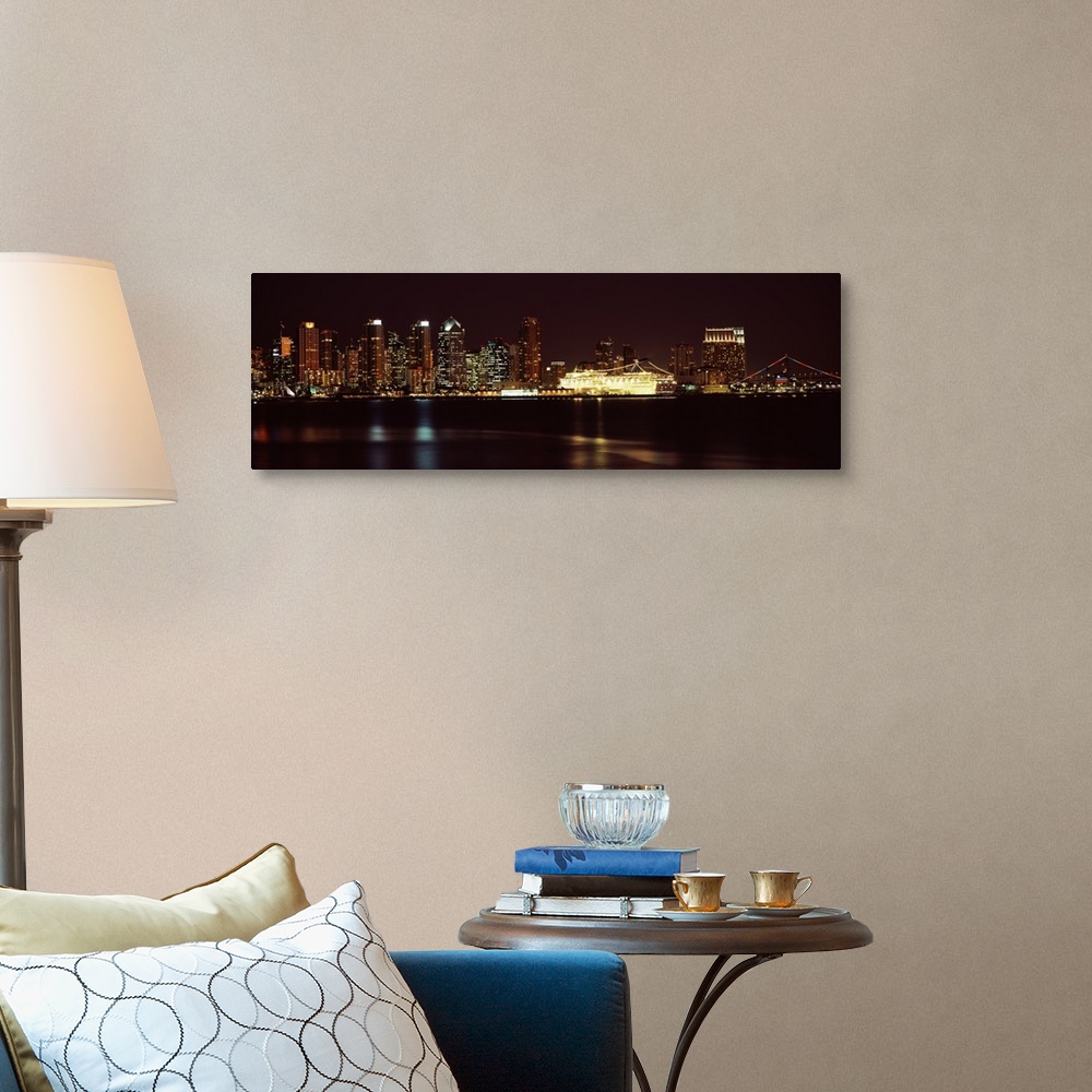 A traditional room featuring Panoramic photograph on a big wall hanging of the San Diego skyline along the edge of the water, ...