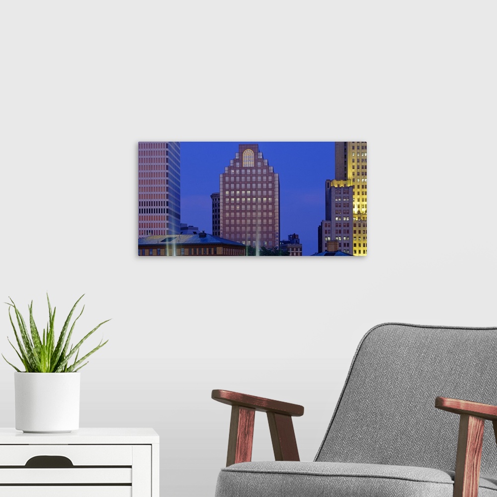 A modern room featuring Buildings illuminated at dusk, Providence, Rhode Island