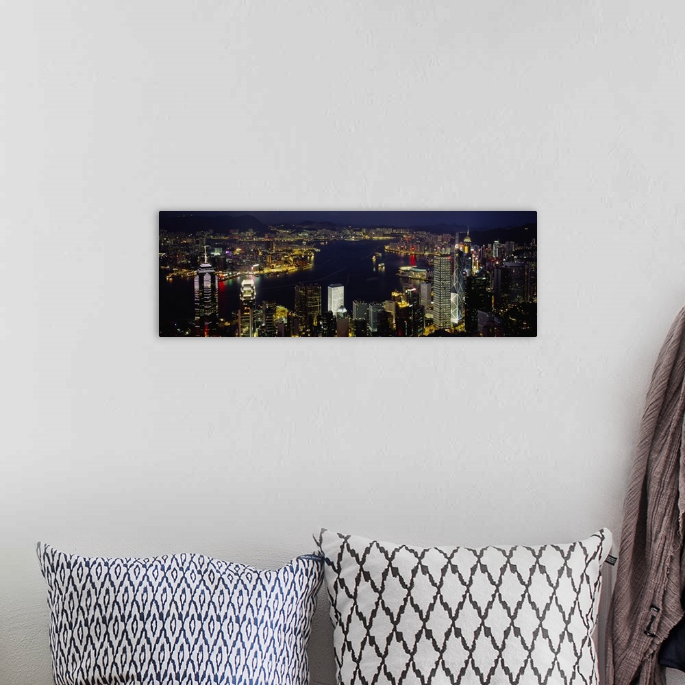 A bohemian room featuring Panoramic photograph shows a nighttime aerial view overlooking a busy city-state that is enclosed...