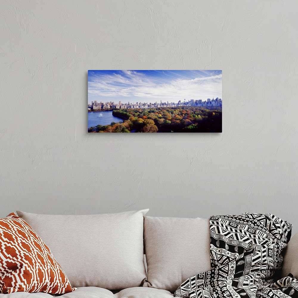 A bohemian room featuring NYC skyline as seen with Central Park in the foreground during the fall.