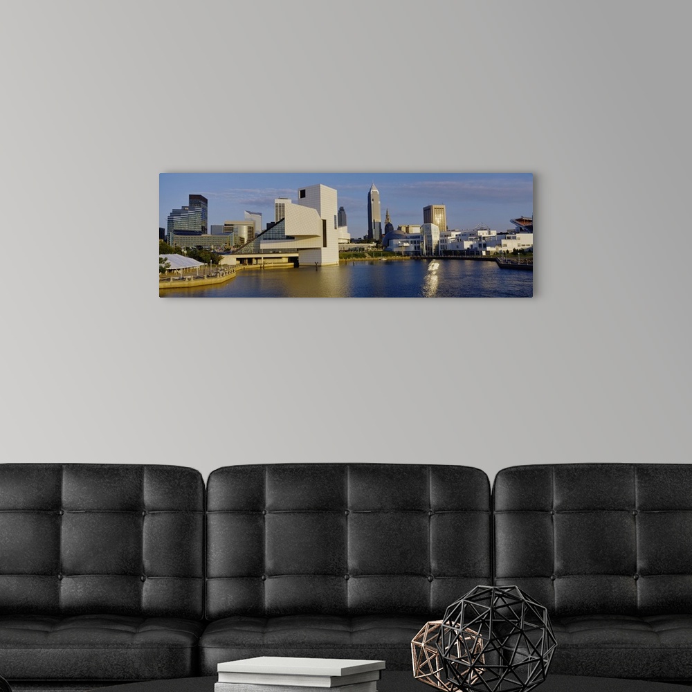 A modern room featuring Panoramic photograph of skyline and waterfront under a cloudy sky.