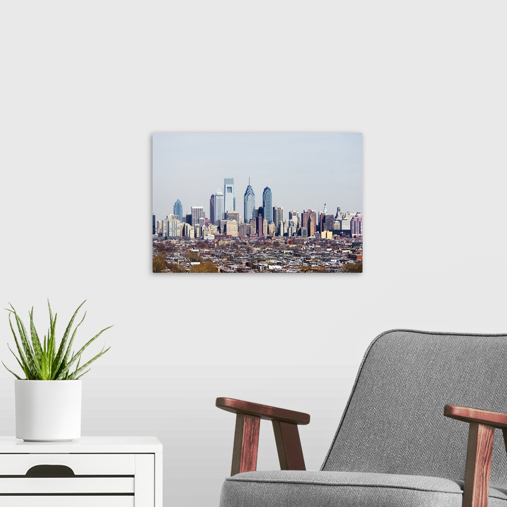 A modern room featuring Panoramic photograph of cityscape with tall buildings and skyscrapers.