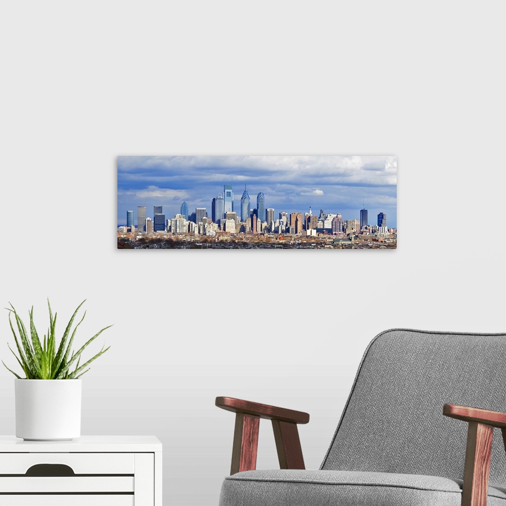 A modern room featuring Large horizontal panoramic photograph of the Philadelphia, Pennsylvania (PA) skyline and surround...