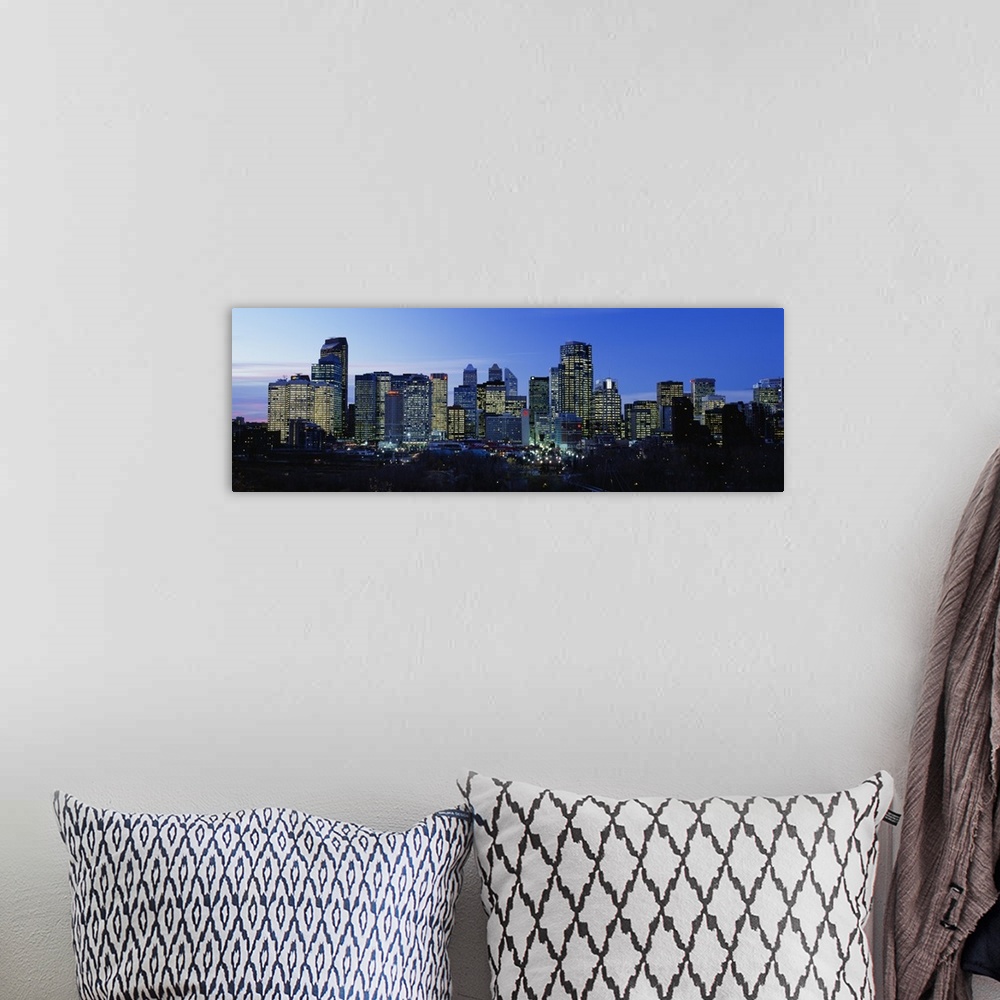 A bohemian room featuring Buildings in a city lit up at dusk, Calgary, Alberta, Canada