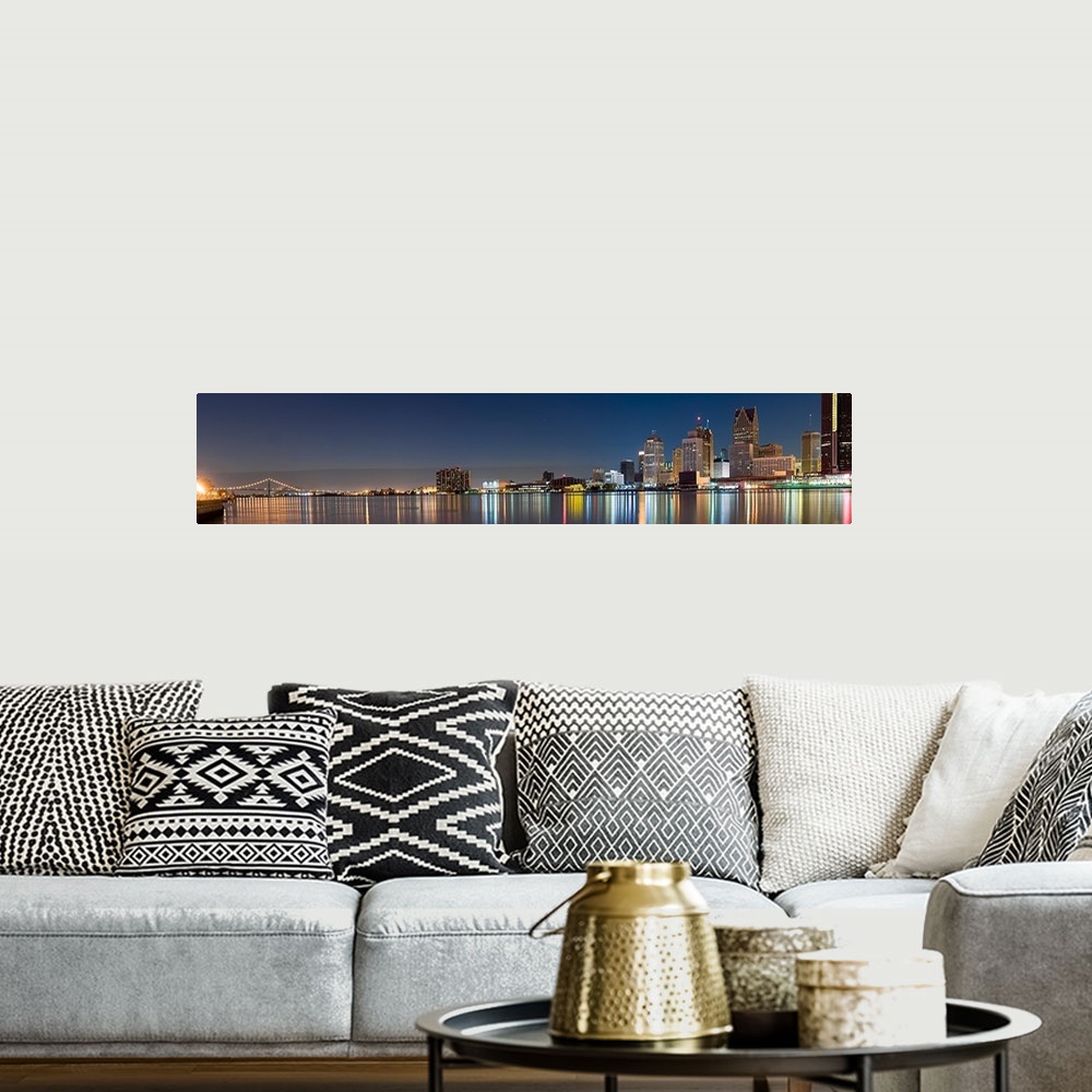A bohemian room featuring Buildings in a city lit up at dusk, Detroit River, Detroit, Michigan,