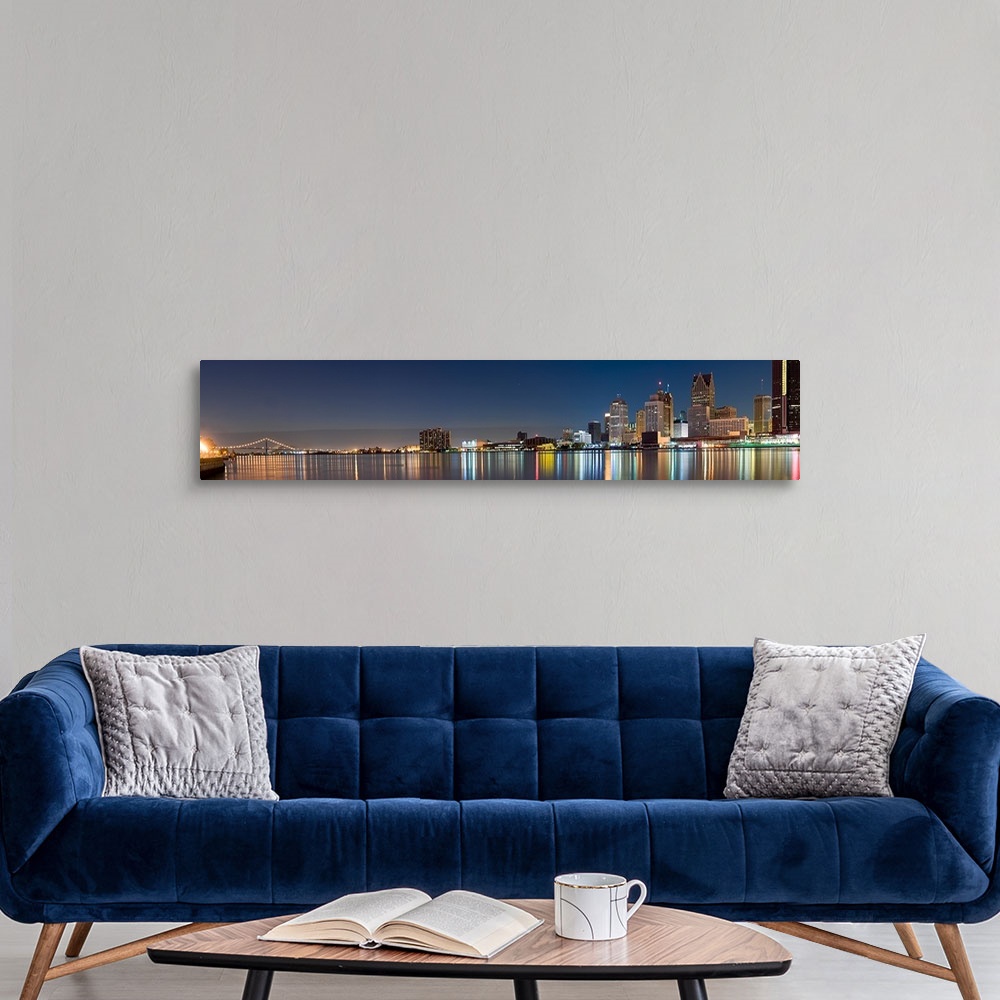 A modern room featuring Buildings in a city lit up at dusk, Detroit River, Detroit, Michigan,