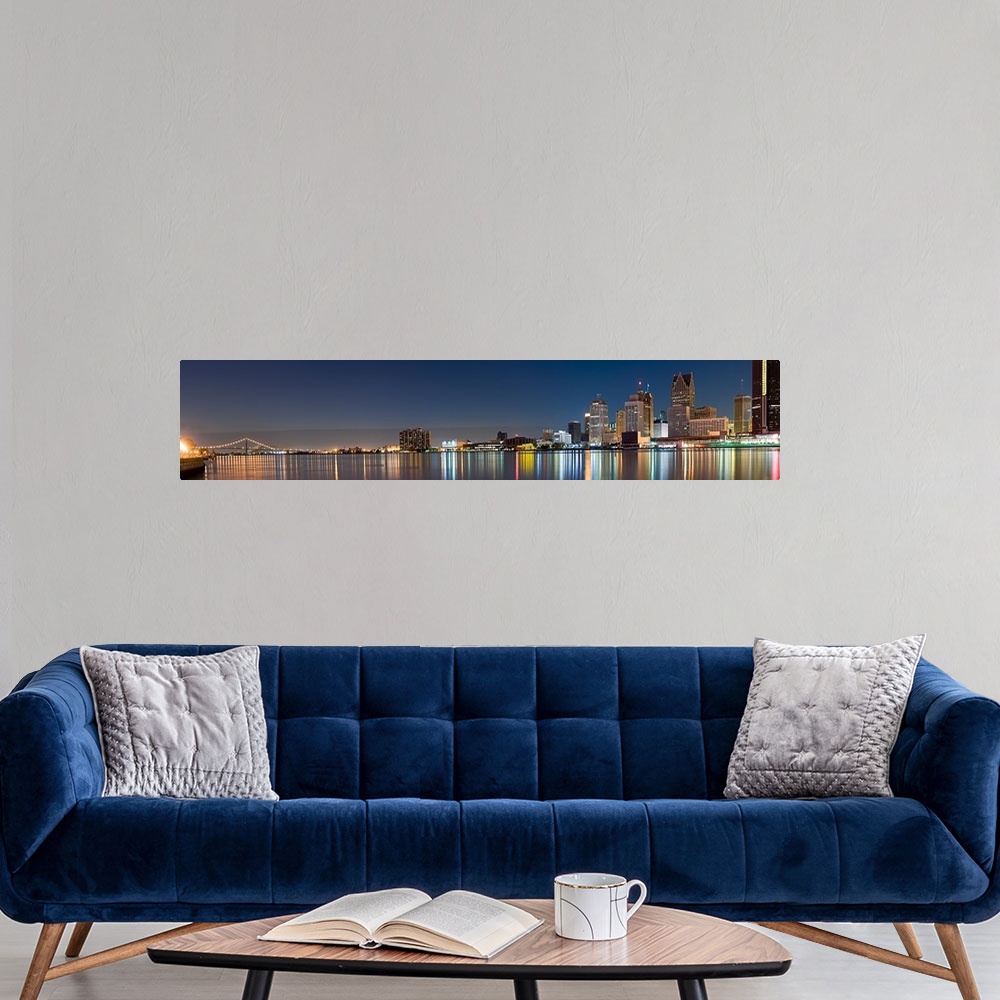 A modern room featuring Buildings in a city lit up at dusk, Detroit River, Detroit, Michigan,