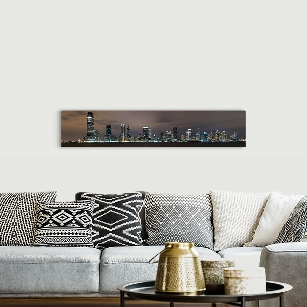 A bohemian room featuring Buildings in a city lit up at night, Hudson River, Jersey City, Hudson County, New Jersey,