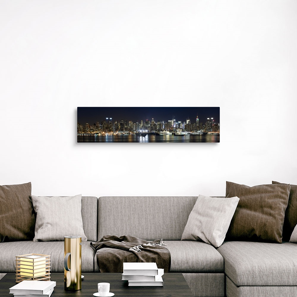 A traditional room featuring Panoramic photograph of city skyline at dusk with the building lights reflected in the waterfront.