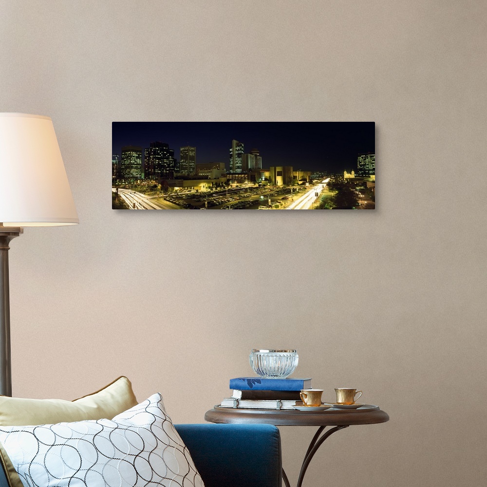 A traditional room featuring Panoramic canvas of buildings in Phoenix illuminated at night.