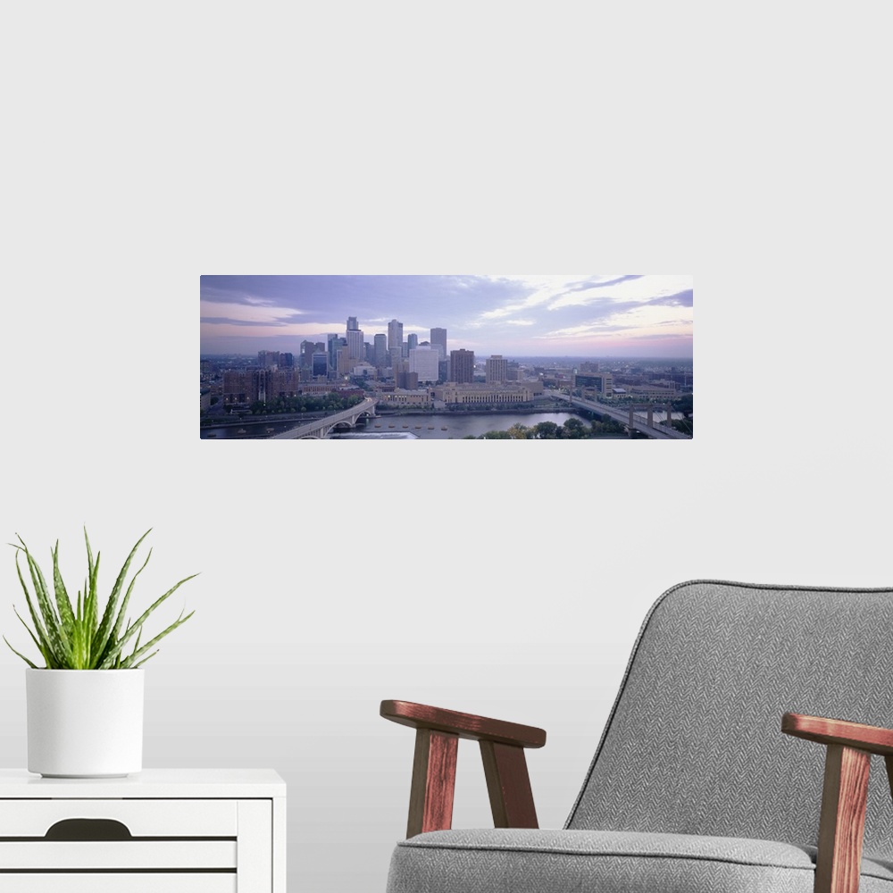 A modern room featuring Large panoramic picture of downtown Minneapolis sitting on the banks of the Mississippi River.