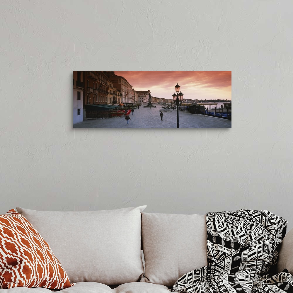 A bohemian room featuring Panoramic photo of people walking on the promenade along the waterfront at sunrise in Venice, Italy.
