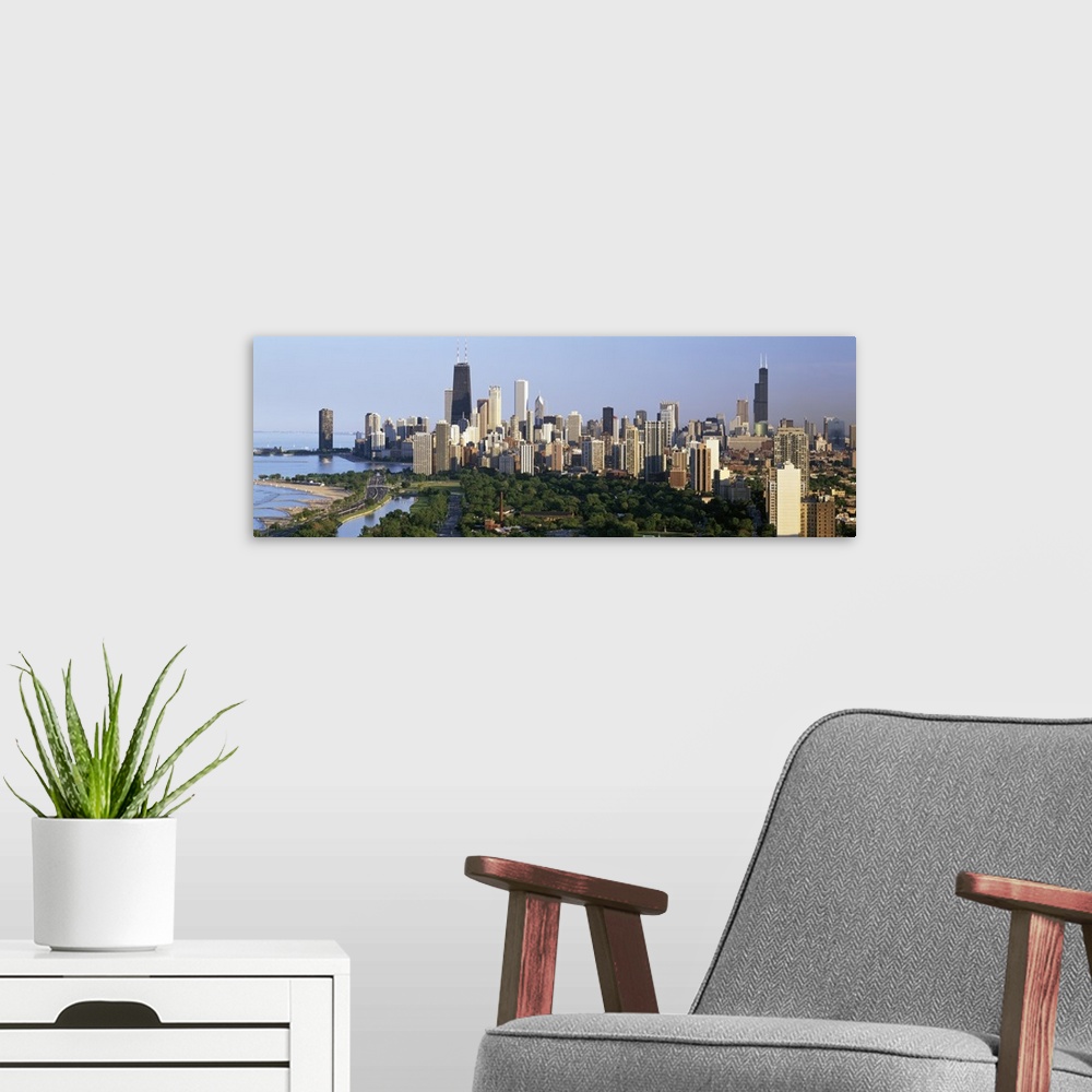 A modern room featuring Panoramic photograph taken from an aerial view overlooking the busiest city of a state within the...