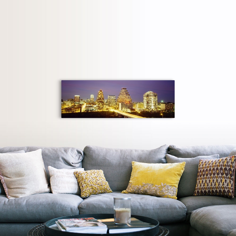 A farmhouse room featuring Panoramic photo of a cityscape brightly lit up at night with slow exposed car lights going throug...