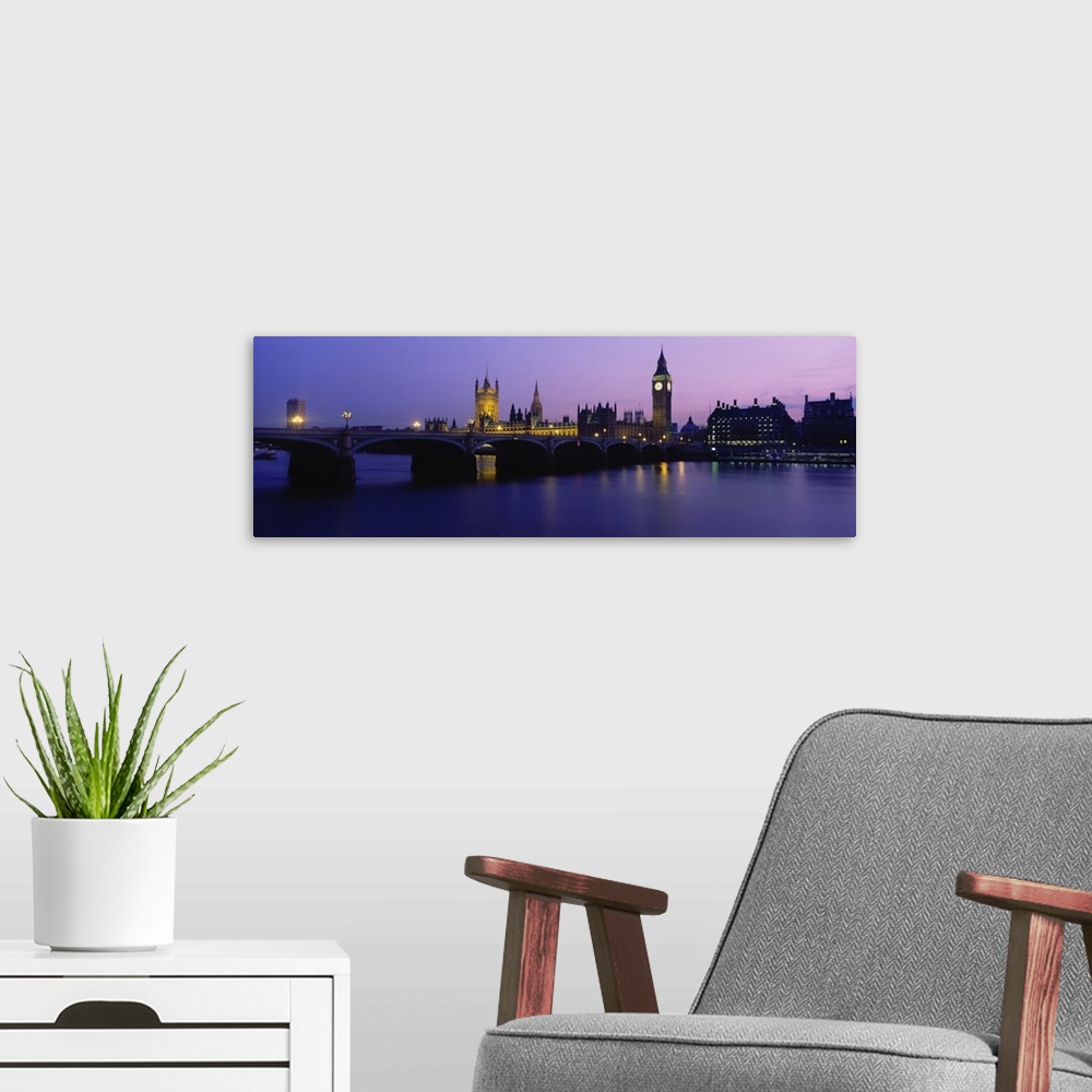 A modern room featuring Buildings lit up at dusk, Big Ben, Houses of Parliament, London, England