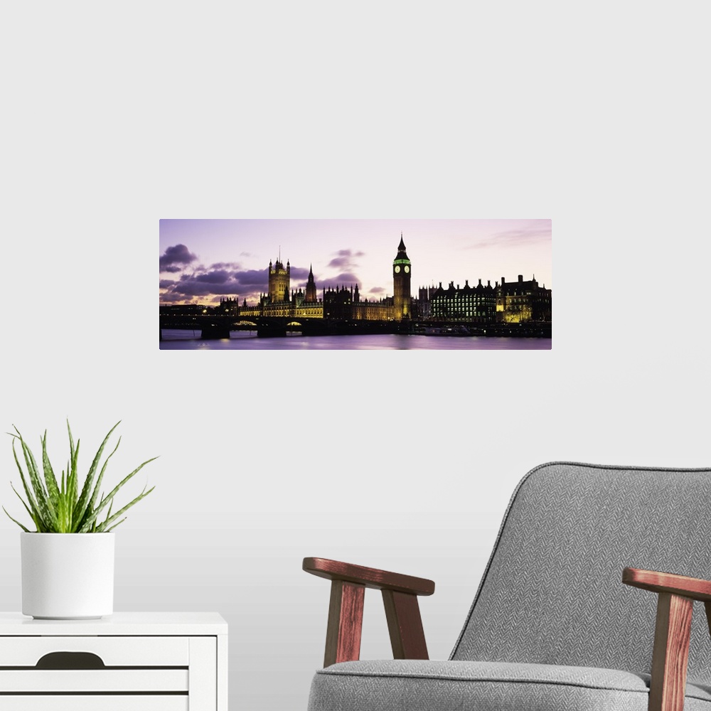 A modern room featuring This is a panoramic photograph taken from the opposite shore of the river showcasing famous landm...