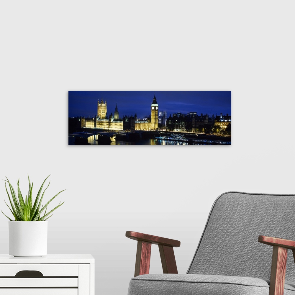 A modern room featuring Buildings lit up at dusk, Westminster Bridge, Big Ben, Houses Of Parliament, Westminster, London,...