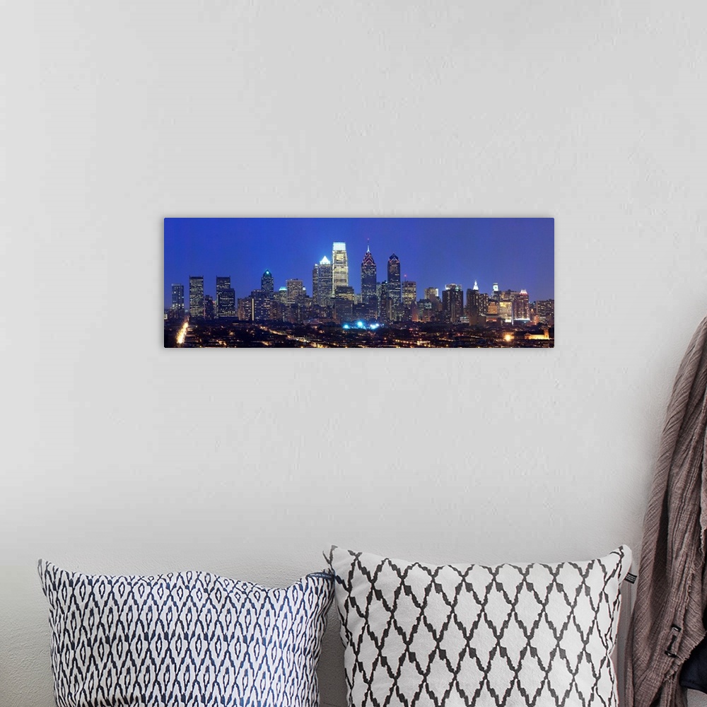 A bohemian room featuring Panoramic nightscape photograph of the Philadelphia skyline.
