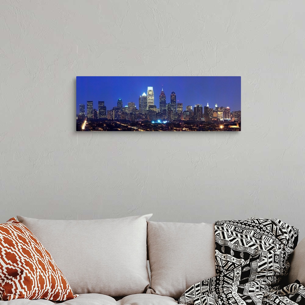A bohemian room featuring Panoramic nightscape photograph of the Philadelphia skyline.